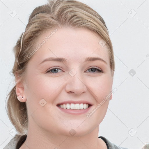 Joyful white young-adult female with long  brown hair and blue eyes