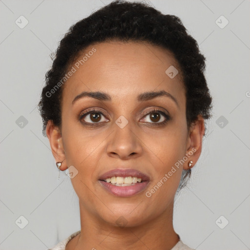 Joyful black young-adult female with short  brown hair and brown eyes