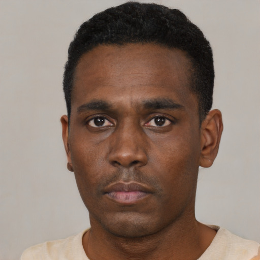Neutral black young-adult male with short  black hair and brown eyes