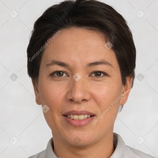 Joyful white adult female with short  brown hair and brown eyes