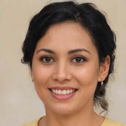 Joyful latino young-adult female with medium  brown hair and brown eyes