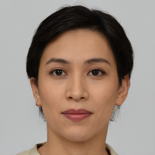 Joyful asian young-adult female with short  brown hair and brown eyes