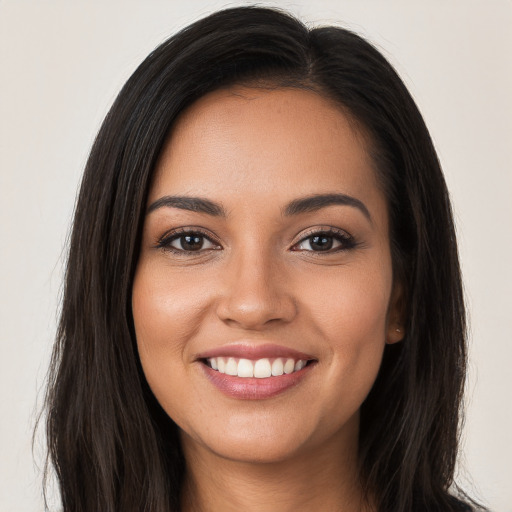 Joyful white young-adult female with long  brown hair and brown eyes