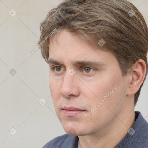 Neutral white young-adult male with short  brown hair and grey eyes