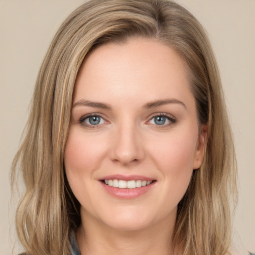 Joyful white young-adult female with long  brown hair and green eyes