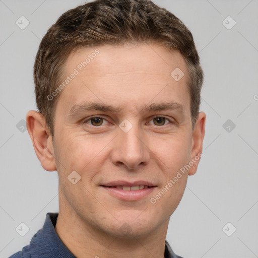 Joyful white adult male with short  brown hair and grey eyes