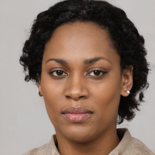 Neutral black adult female with short  black hair and brown eyes