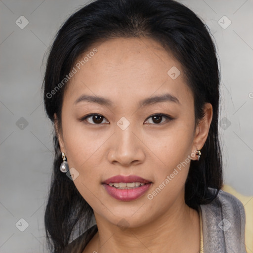 Joyful asian young-adult female with medium  black hair and brown eyes