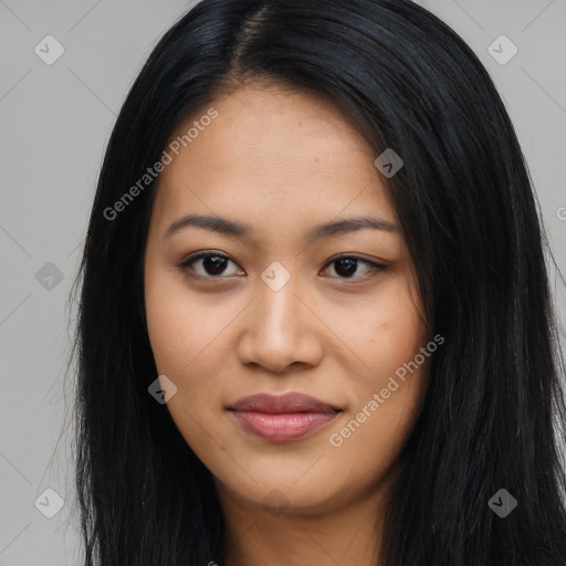 Joyful latino young-adult female with long  black hair and brown eyes