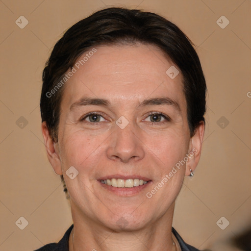 Joyful white adult female with short  brown hair and brown eyes