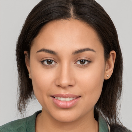 Joyful white young-adult female with long  brown hair and brown eyes