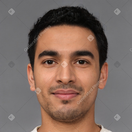 Joyful latino young-adult male with short  black hair and brown eyes