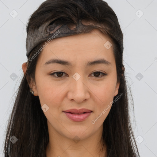 Joyful asian young-adult female with long  brown hair and brown eyes