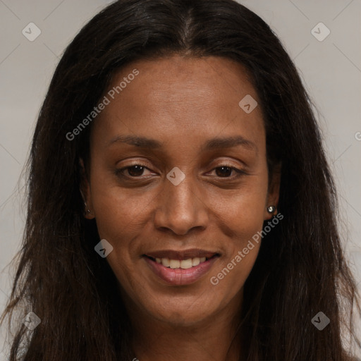 Joyful black young-adult female with long  brown hair and brown eyes