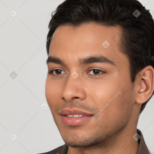 Joyful white young-adult male with short  black hair and brown eyes