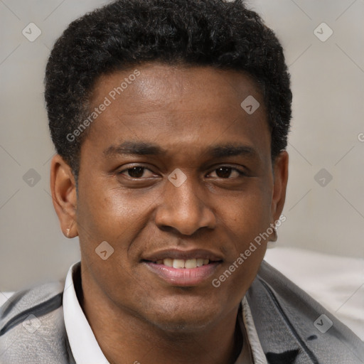 Joyful latino young-adult male with short  brown hair and brown eyes