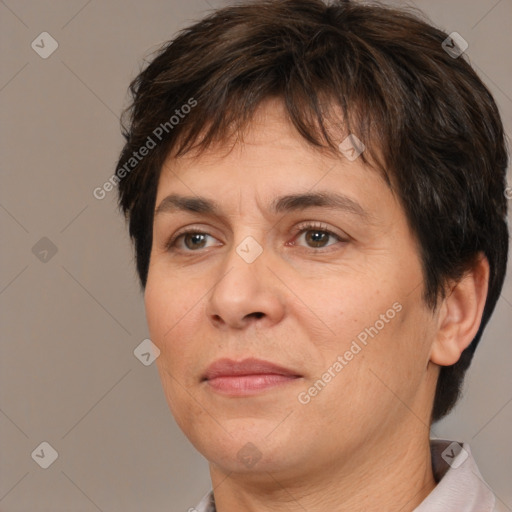 Joyful white adult female with short  brown hair and brown eyes