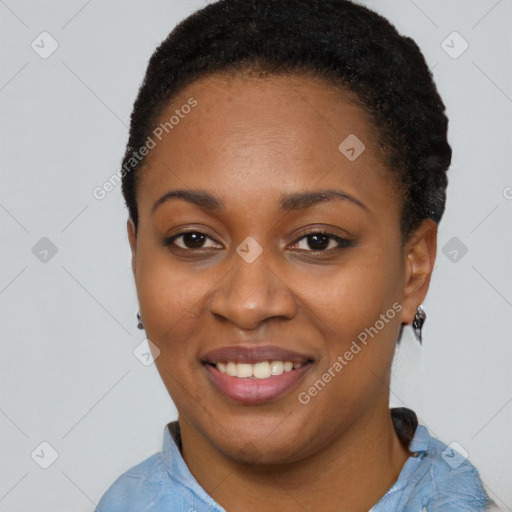 Joyful black young-adult female with short  brown hair and brown eyes