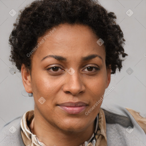 Joyful black adult female with short  brown hair and brown eyes