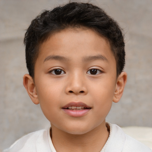 Joyful asian child male with short  brown hair and brown eyes