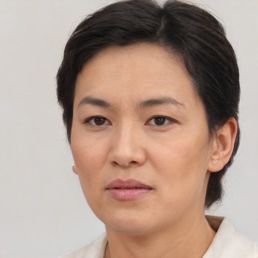 Neutral white adult female with short  brown hair and brown eyes