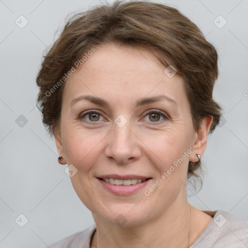 Joyful white adult female with medium  brown hair and grey eyes