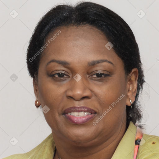 Joyful black adult female with short  brown hair and brown eyes