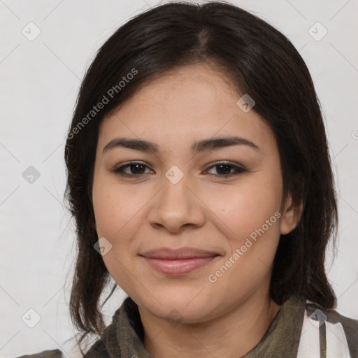 Joyful latino young-adult female with medium  brown hair and brown eyes