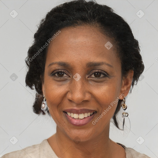 Joyful black adult female with short  brown hair and brown eyes