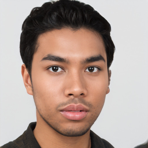 Neutral latino young-adult male with short  brown hair and brown eyes