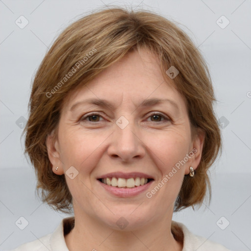 Joyful white adult female with medium  brown hair and grey eyes