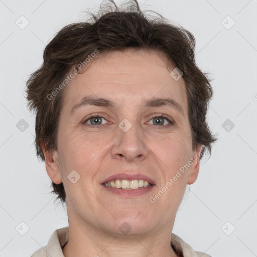 Joyful white adult male with short  brown hair and grey eyes