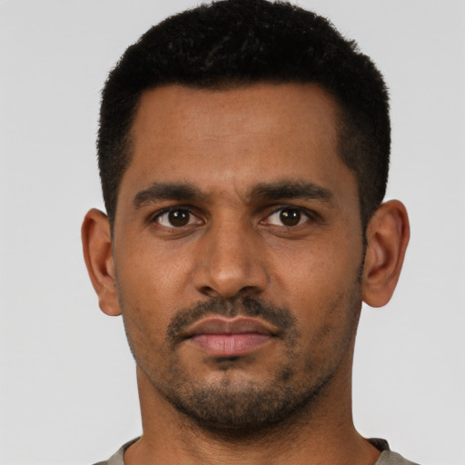 Neutral latino young-adult male with short  black hair and brown eyes