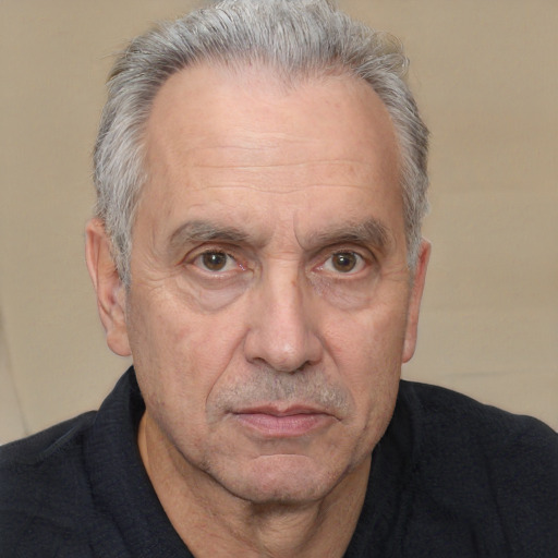 Neutral white middle-aged male with short  gray hair and brown eyes