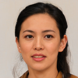 Joyful asian young-adult female with medium  brown hair and brown eyes