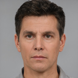 Neutral white adult male with short  brown hair and brown eyes