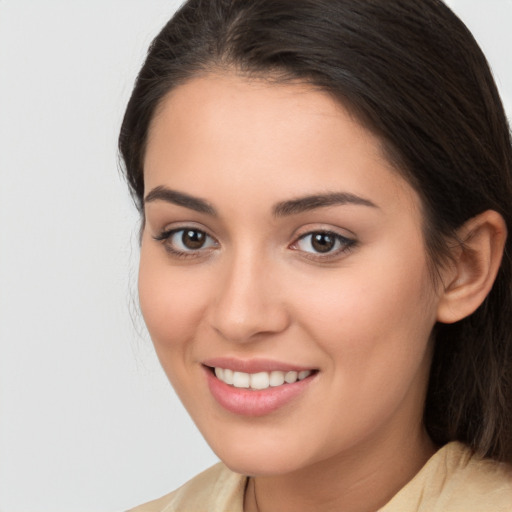 Joyful white young-adult female with medium  brown hair and brown eyes