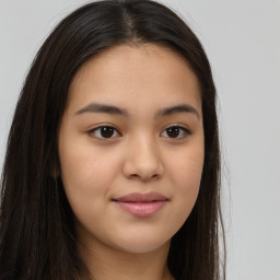 Joyful asian young-adult female with long  brown hair and brown eyes