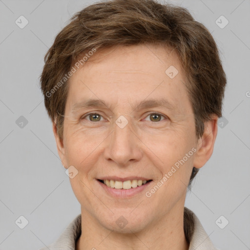 Joyful white adult male with short  brown hair and grey eyes