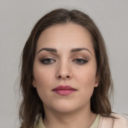 Neutral white young-adult female with medium  brown hair and brown eyes