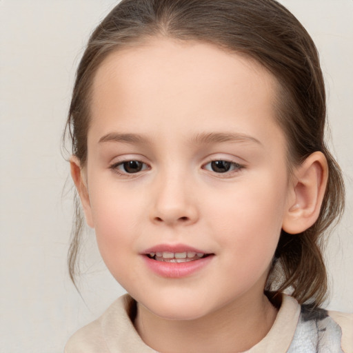 Joyful white child female with medium  brown hair and brown eyes