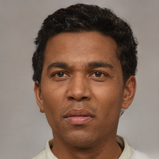 Neutral black adult male with short  brown hair and brown eyes