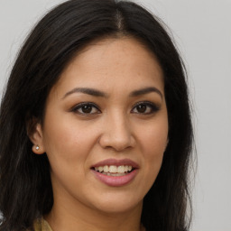 Joyful white young-adult female with long  brown hair and brown eyes