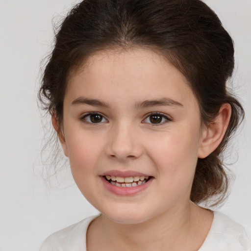 Joyful white child female with medium  brown hair and brown eyes