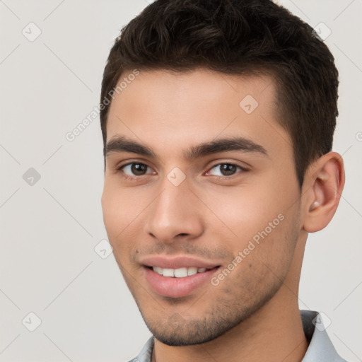 Joyful white young-adult male with short  brown hair and brown eyes