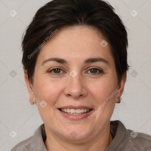 Joyful white adult female with short  brown hair and brown eyes