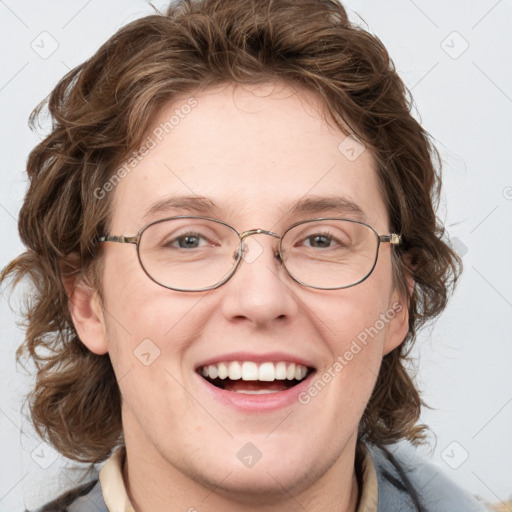 Joyful white adult female with medium  brown hair and blue eyes