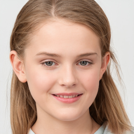 Joyful white child female with long  brown hair and grey eyes