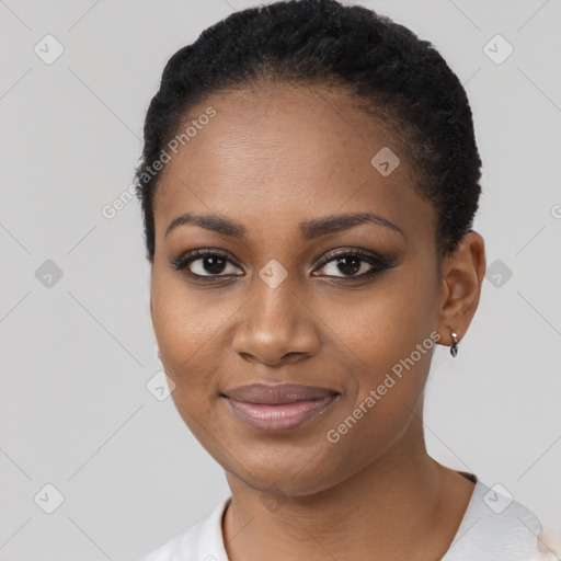 Joyful black young-adult female with short  black hair and brown eyes