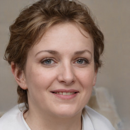 Joyful white young-adult female with medium  brown hair and blue eyes